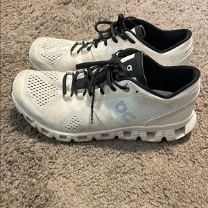 On Running White and Black Athletic Shoes with Cloud Cushioning